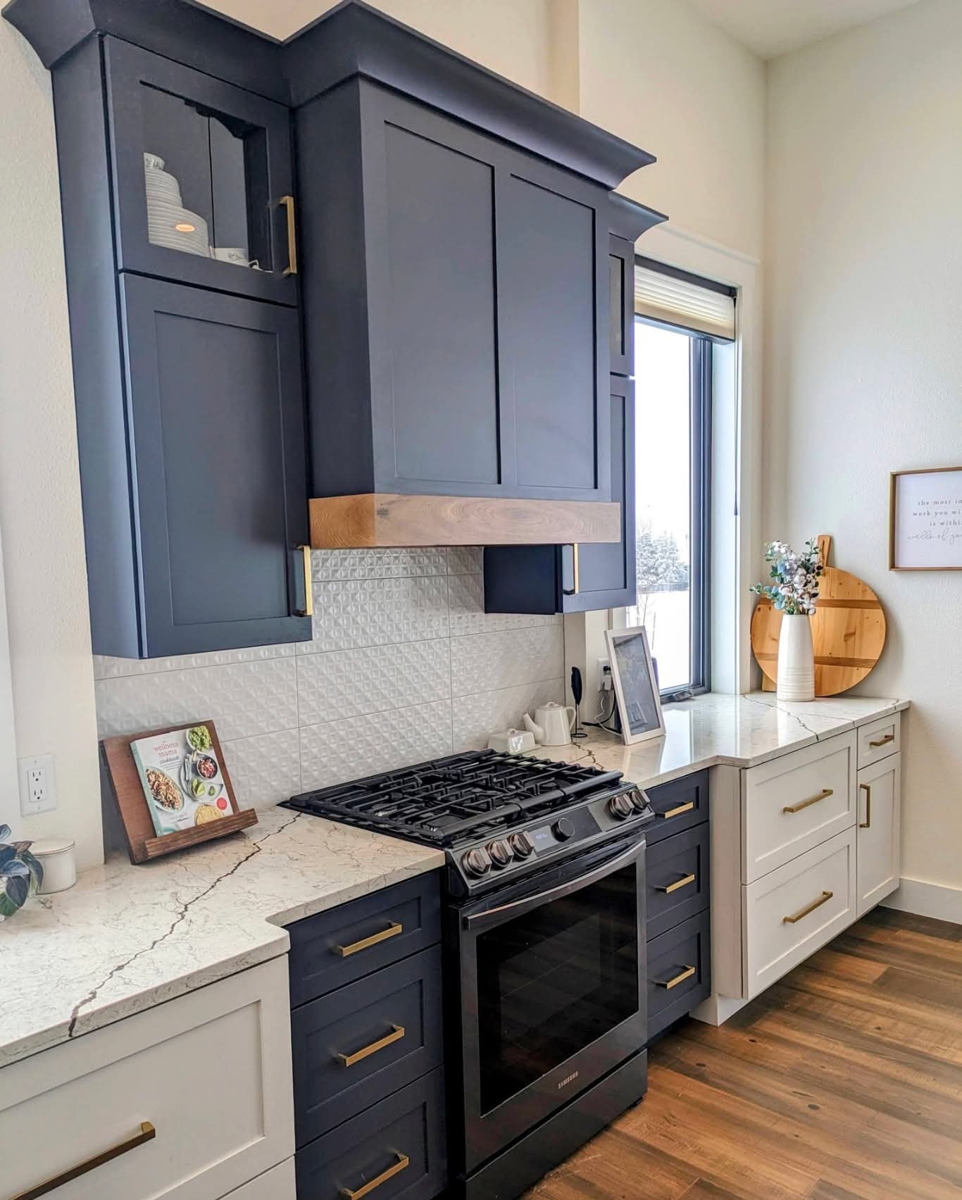 Castle Rock navy and white kitchen — quartzite countertops