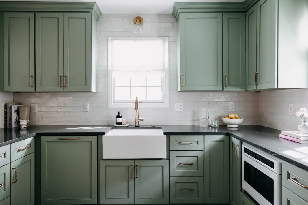 Kitchen renovation in Greenwood Village area — sage green cabinetry by PrestigeCore Design + Build